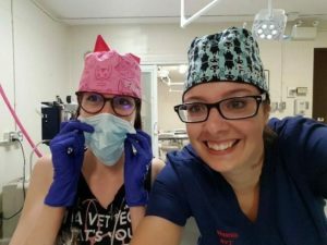 Victoria and Venessa wearing surgical caps